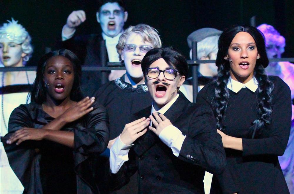 Pickerington High School central students performing The Addams Family musical